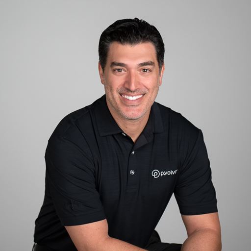 Brunette man smiles in black P.volve shirt