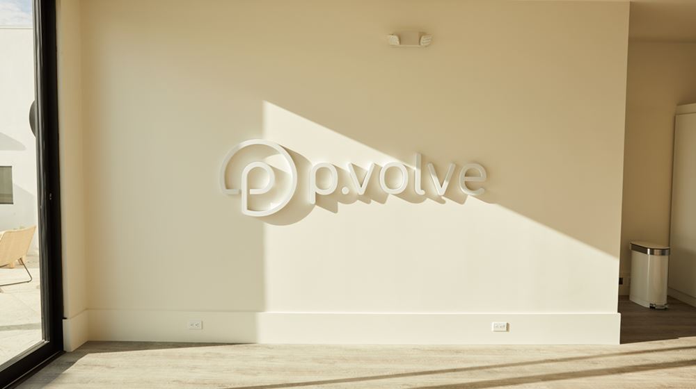Afternoon light illuminates P.volve sign in a studio