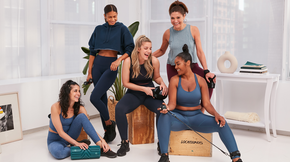 Pvolve members sitting and talking together.